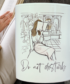 do not disturb reading mug cozy setup with book and coffee