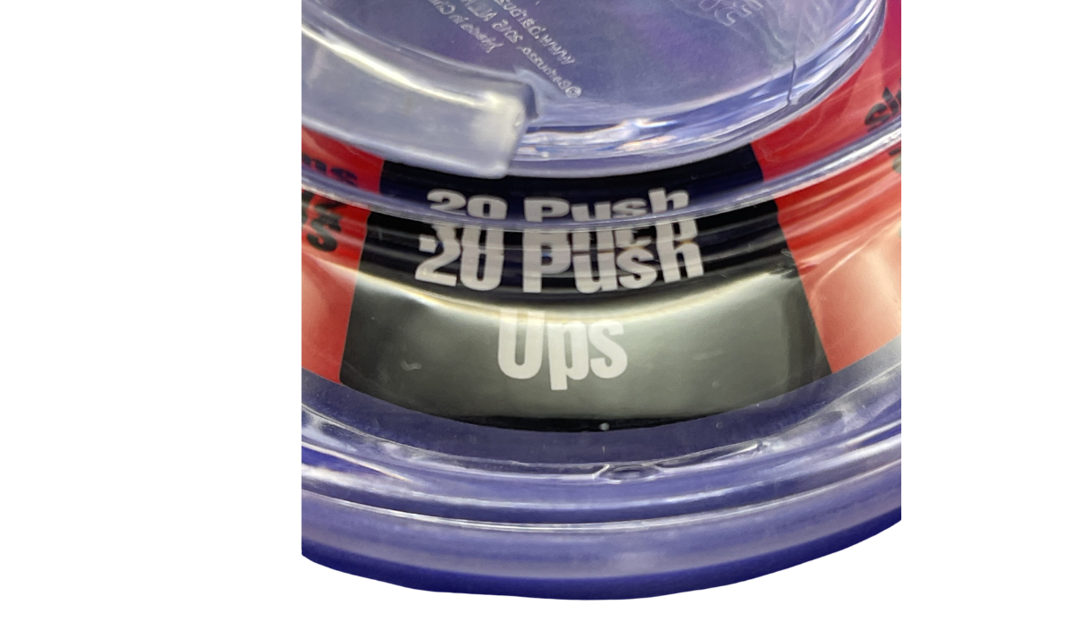 Pinball Pint Glass Drinking Game bottom view showing the colorful action wheel and visible 20 Push Ups challenge prompt