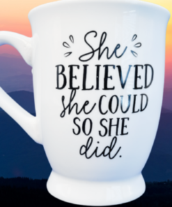 Mud Pie She Believed Mug styled with inspirational scenery and uplifting morning atmosphere