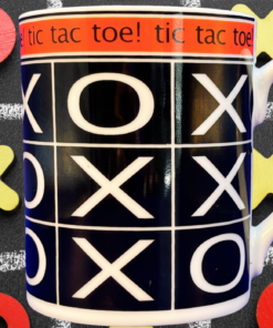 Godinger Tic Tac Toe Mug displayed against a chalkboard tic-tac-toe game with red O pieces and yellow X playing pieces.