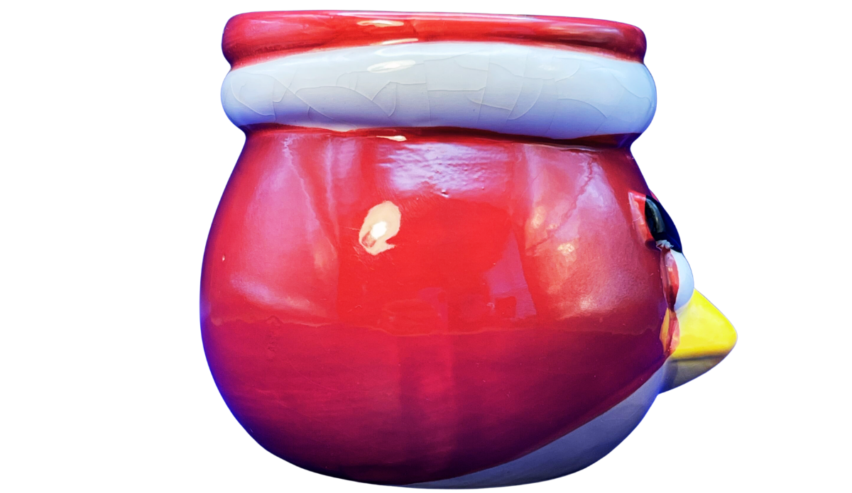 Side view of 3D Angry Bird Santa Mug showing rounded red ceramic body and projecting yellow beak