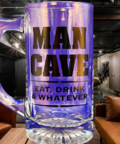 Man Cave Beer Mug displayed in a dark home lounge with brown leather seating