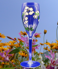 Perrier Jouet White Floral Champagne Flute styled outdoors with flowers and bright colors