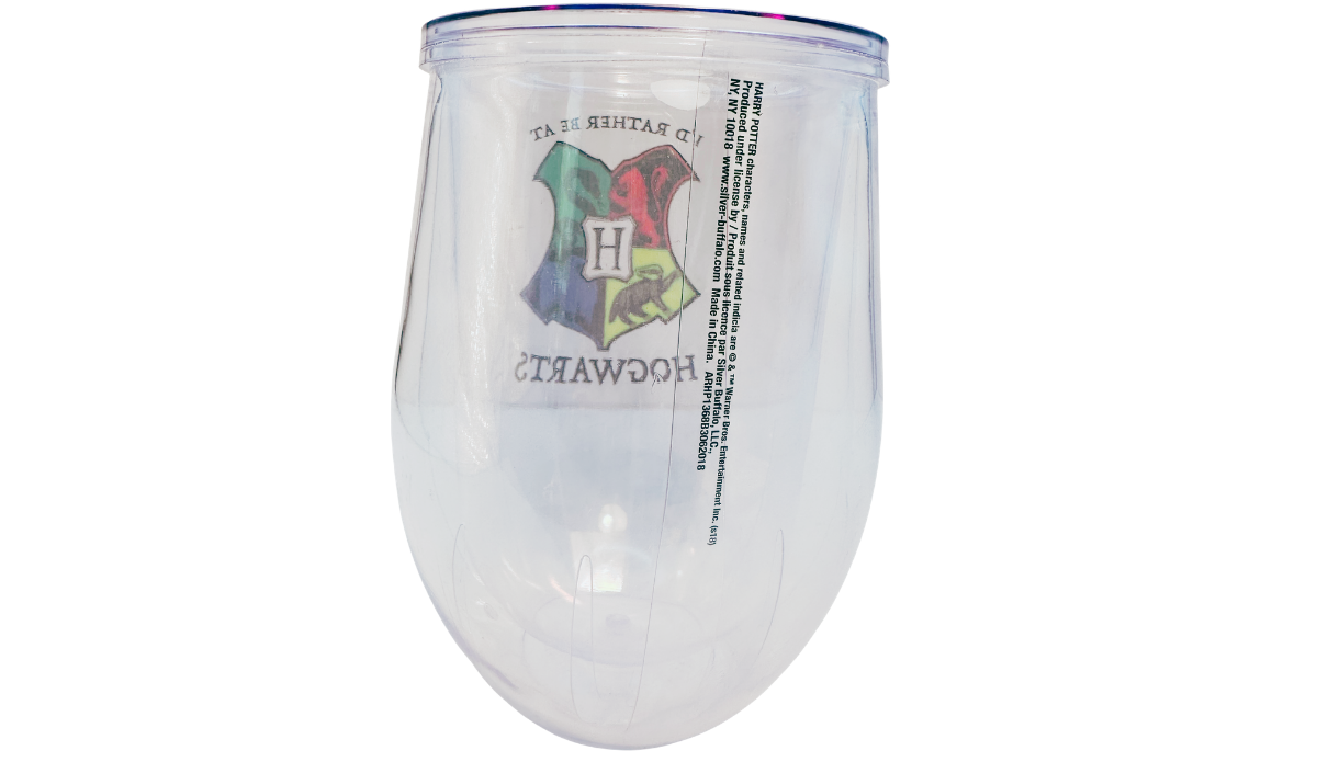Harry Potter Hogwarts Stemless Travel Tumbler back view showing the reverse side through the clear double-wall acrylic with the mirrored Hogwarts crest and official Silver Buffalo licensing information.
