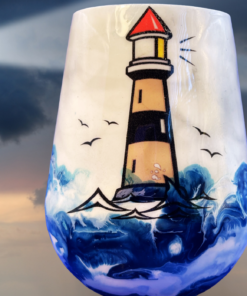 Back of Lighthouse Stemless Wine Glass with inspirational quote above swirling blue ocean wave artwork