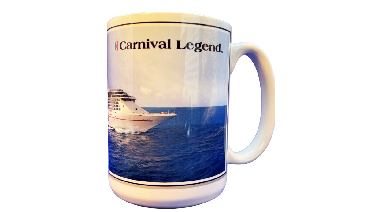 Carnival Legend Cruise Ship Souvenir Mug front view featuring the Carnival Legend name above a bow view of the ship sailing across deep blue ocean waters