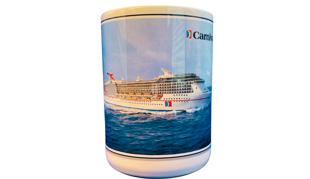 Carnival Legend Cruise Ship Souvenir Mug middle view showing the Carnival Legend sailing across open ocean waters within the wraparound artwork