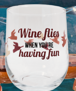 wine flies when you're having fun wine glass lifestyle scene with wine and relaxed social setting showing playful bird wraparound design