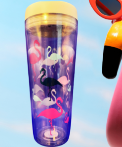 colorful flamingo acrylic tumbler with lid next to large pink flamingo with sunglasses and tropical drink