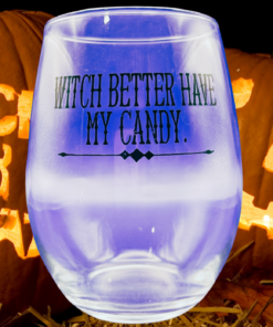 Witch Stemless Wine Glass displayed with glowing jack-o’-lanterns, autumn leaves, and straw for Halloween