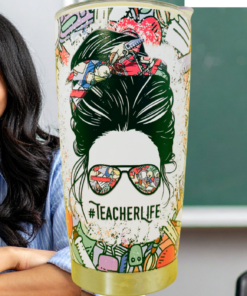 Teacher Life Tumbler beside smiling teacher in classroom with chalkboard background