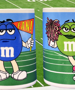 M&M's Football Cheerleader And Fan mug lifestyle scene showing Green and Blue M&M football character sides