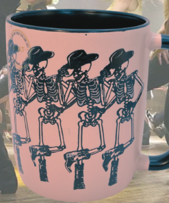 pink cowgirl skeleton mug with dancing skeleton design in lively party scene