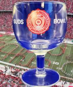 Ohio State Suds Bowl Glass displayed against an Ohio State football stadium filled with Buckeyes fans and marching band activity