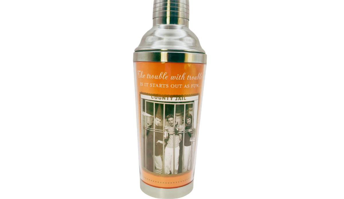 Shannon Martin Trouble Starts Cocktail Shaker front view with orange wrap, County Jail photograph, and humorous quote