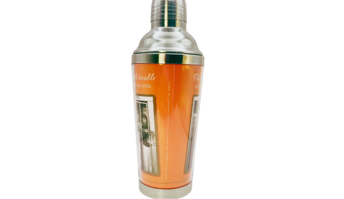 Shannon Martin cocktail shaker middle view with orange wrap, copyright lettering, and partial County Jail artwork