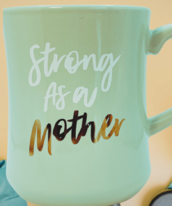 strong as a mother mug styled with workout gear sneakers and yoga mat fitness setting
