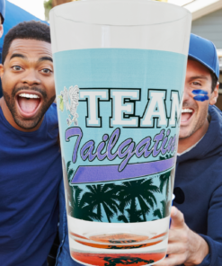 Team Tailgating Palm Tree Pint Glass displayed at a football tailgate gathering