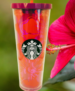 2014 Starbucks Purple Red Hibiscus Venti Tumbler displayed beside bright pink hibiscus flower
