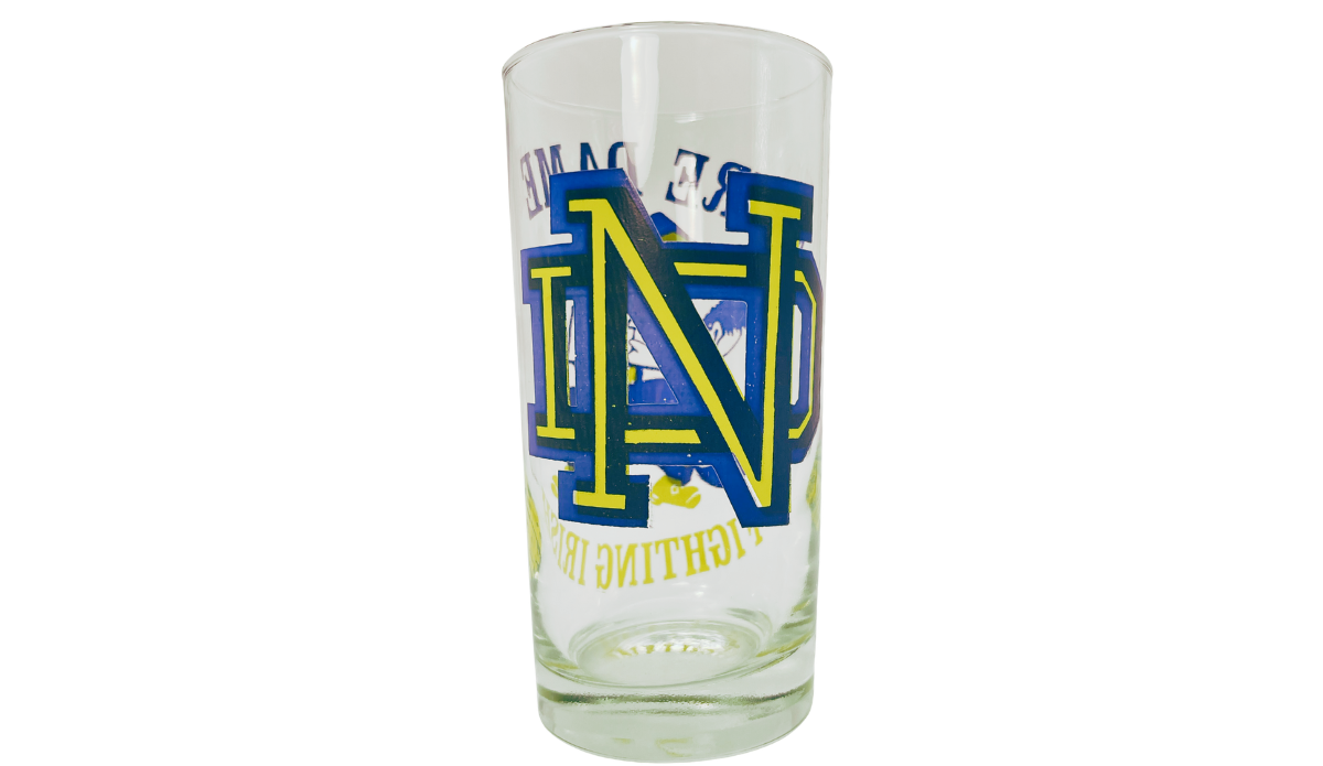Fighting Irish Leprechaun Glass side view with large blue and yellow interlocking ND monogram and Notre Dame lettering