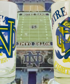 Fighting Irish Leprechaun Glass shown from two sides against a Notre Dame football stadium background