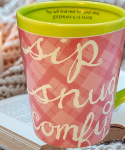 sip snug comfy mug styled with book candle and blanket cozy morning setting