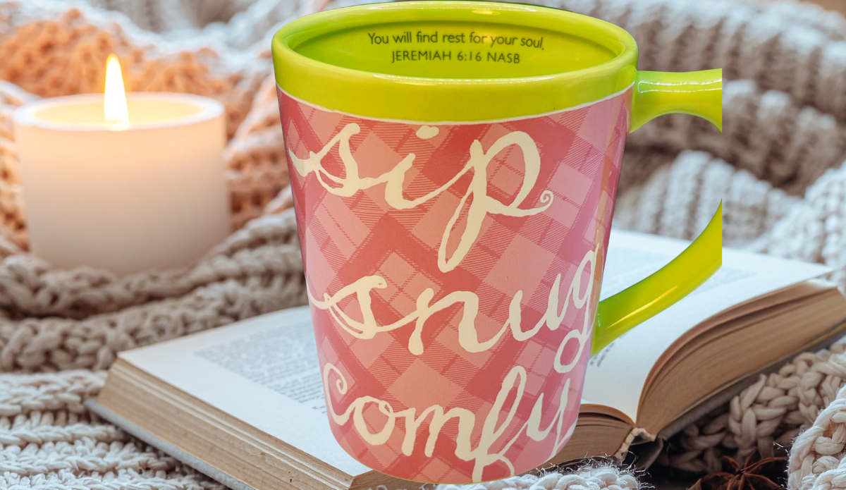 sip snug comfy mug styled with book candle and blanket cozy morning setting
