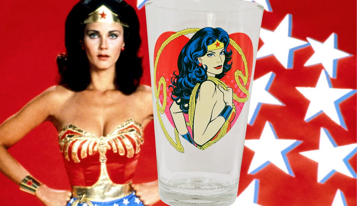 Wonder Woman Hotness Pint Glass displayed with classic Wonder Woman superhero imagery and red white and blue star background