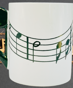 musical notes mug styled with music themed decor and notes background