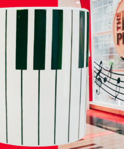 3D FAO Schwarz Piano Mug styled beside Big Piano musical display
