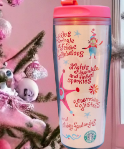2006 Starbucks Tinsel Sparkles Tumbler displayed beside a pink Christmas tree and snowy window