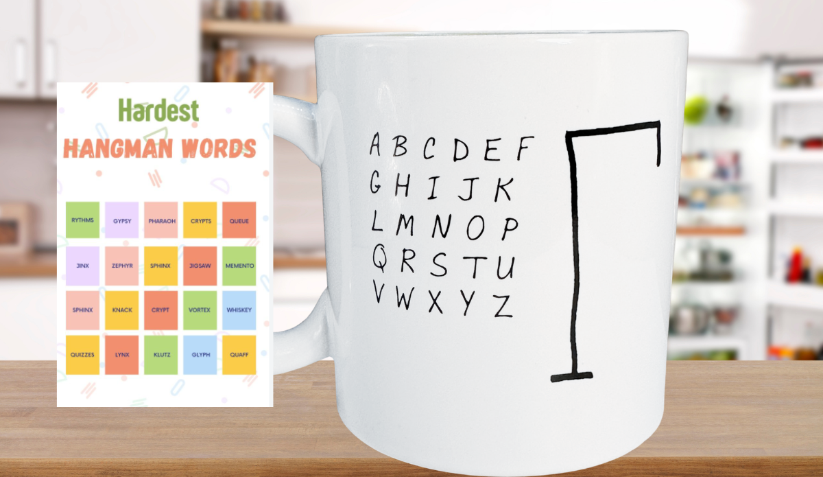 Hangman Game Coffee Mug on a wooden kitchen counter beside a colorful Hardest Hangman Words graphic featuring challenging puzzle words.