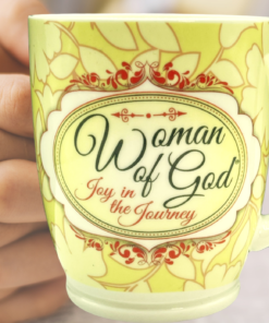 Woman of God Joy in the Journey Mug held during prayer with open bible faith coffee moment
