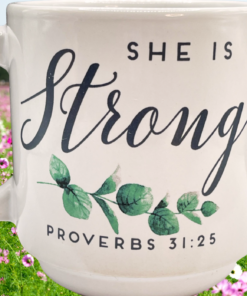 She Is Strong Proverbs 31:25 mug with praying woman in peaceful field representing faith strength and reflection