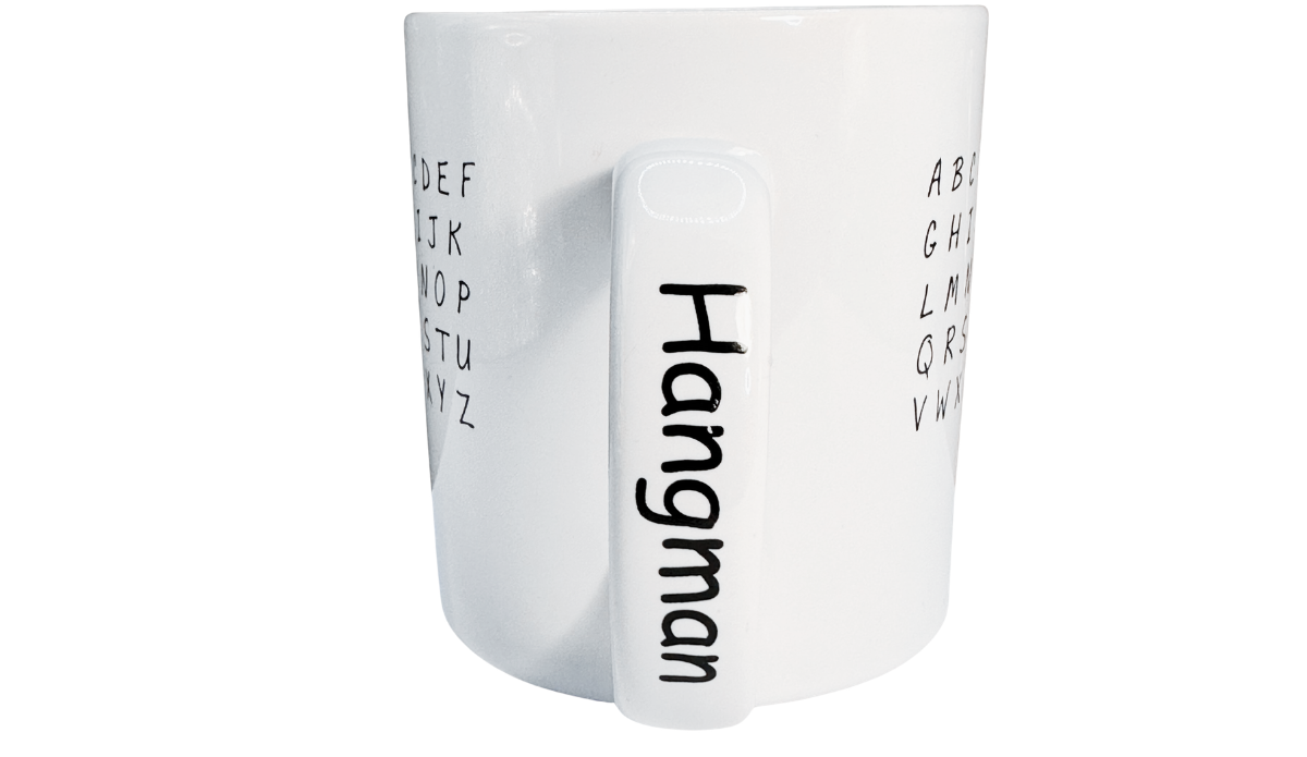 Hangman Game Coffee Mug handle view showing Hangman printed vertically in black letters on the white ceramic handle.