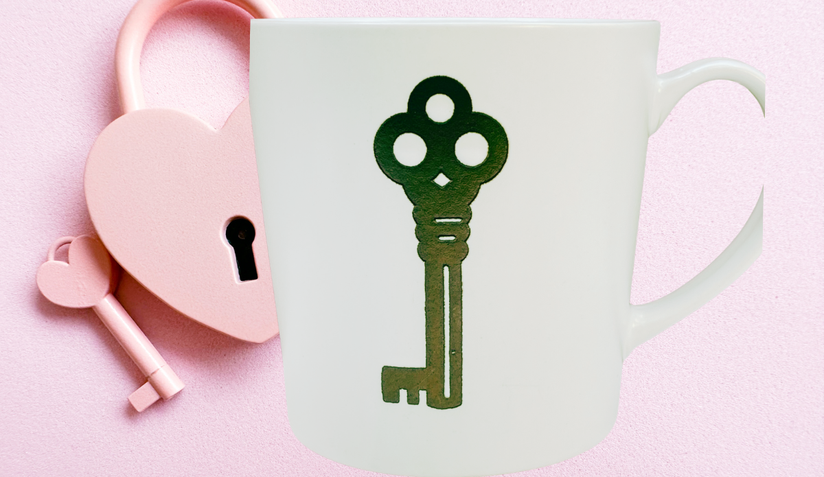 Key Lock Couples Mug styled beside pink Valentine heart lock background