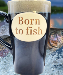 Born To Fish Latte Mug displayed with leaping fish and lake backdrop