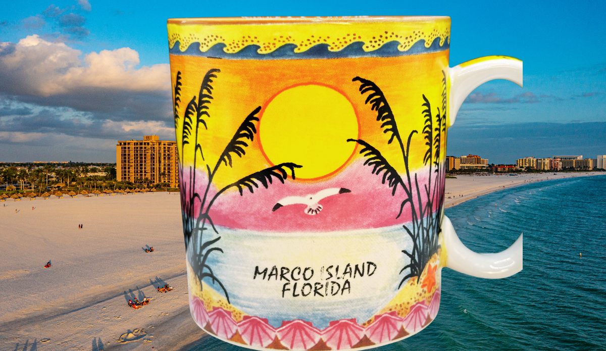 Marco Island Florida souvenir mug displayed against a beautiful Marco Island beach, highlighting its colorful wraparound tropical sunset design.