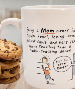 Hallmark Being A Mom Means Funny Mug with chocolate chip cookies on a kitchen table