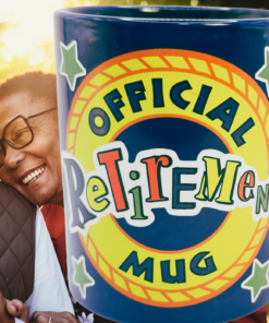 Official Retirement Mug displayed with smiling retired couple outdoors