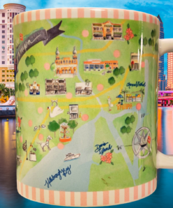 Tampa Florida Illustrated Map Souvenir Mug displayed against the Tampa skyline and waterfront celebrating Florida travel memories