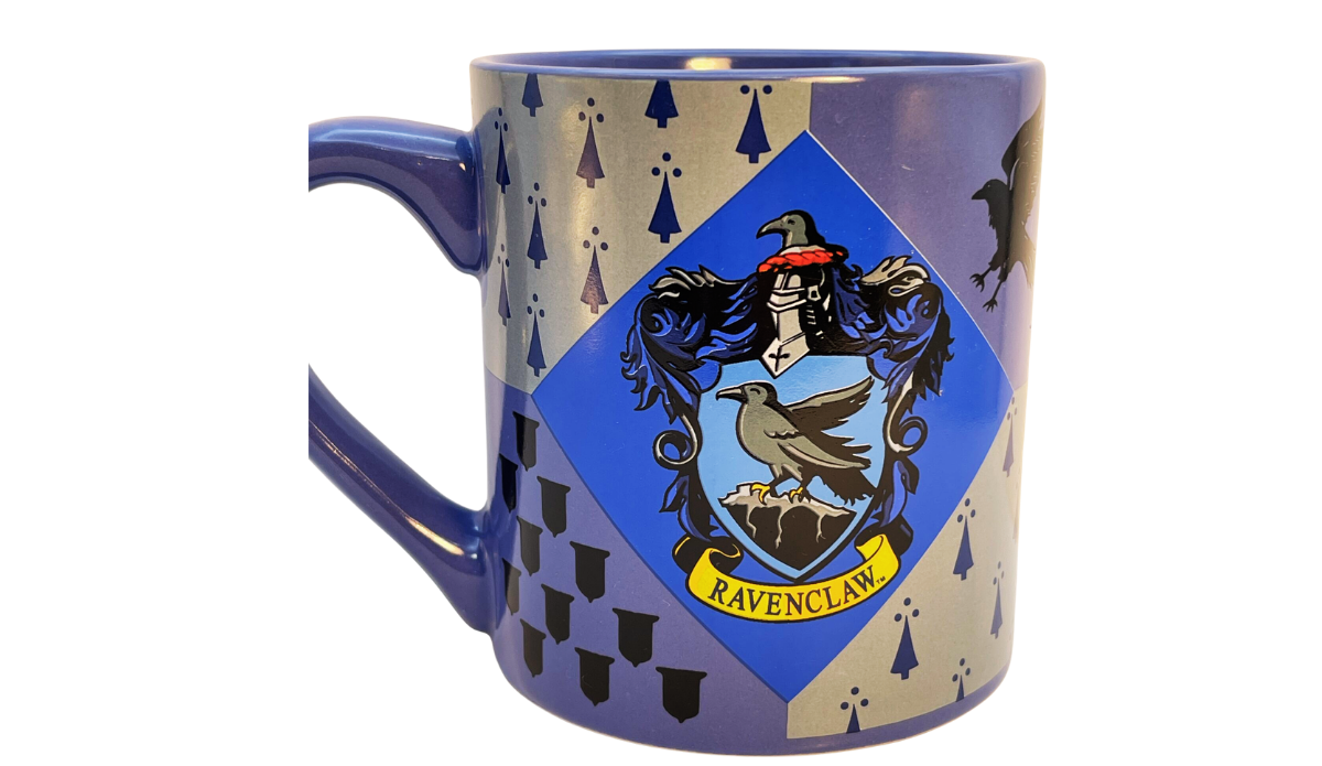 Harry Potter Ravenclaw House Crest Mug featuring the Ravenclaw eagle crest with a blue, silver, and purple wraparound geometric design.