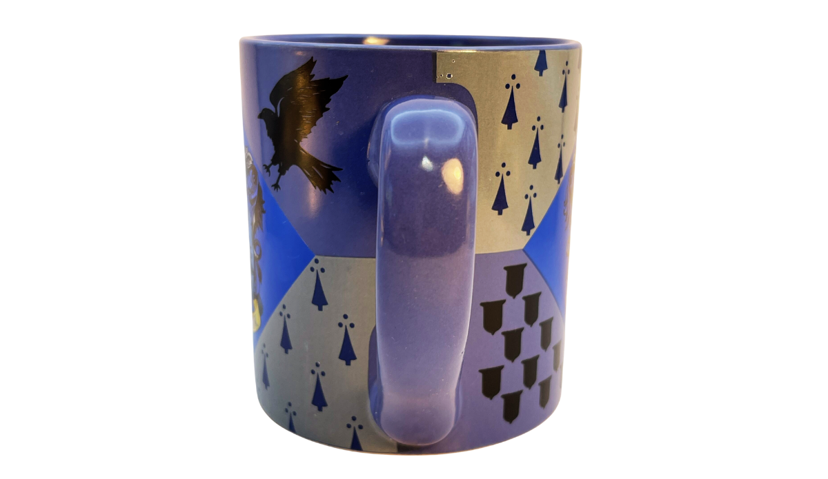 Harry Potter Ravenclaw House Crest Mug handle view featuring the blue handle with wraparound Ravenclaw geometric artwork and black eagle silhouette