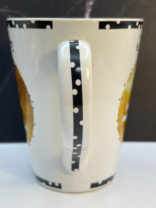 Bring a playful touch of elegance to your routine with the Jennifer Garant Roscher Dollnation Mug. It's the perfect #cupofmood making morning a fun affair!