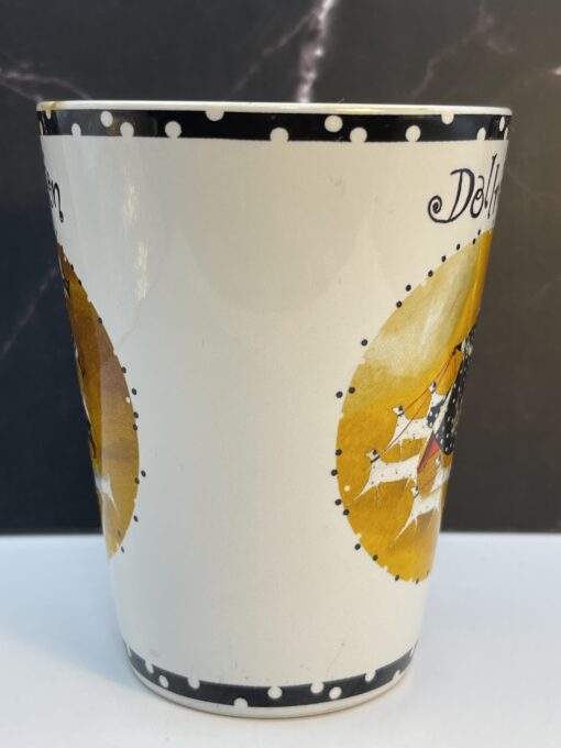 Bring a playful touch of elegance to your routine with the Jennifer Garant Roscher Dollnation Mug. It's the perfect #cupofmood making morning a fun affair!