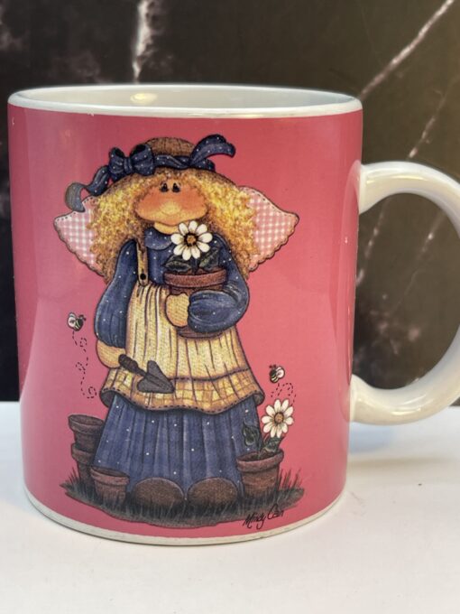 Bring a touch of heavenly beauty to your mornings with the Pink Mindy Cain Garden Angel Mug. It's the perfect #cupofmood and a little serenity in every sip.