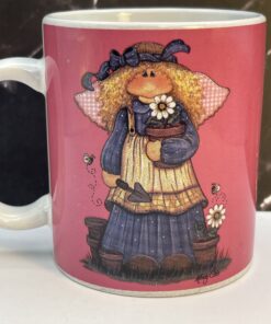 Bring a touch of heavenly beauty to your mornings with the Pink Mindy Cain Garden Angel Mug. It's the perfect #cupofmood and a little serenity in every sip.
