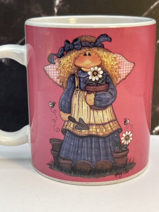 Bring a touch of heavenly beauty to your mornings with the Pink Mindy Cain Garden Angel Mug. It's the perfect #cupofmood and a little serenity in every sip.
