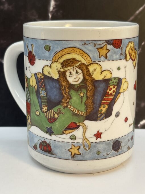 Meet your new favorite sip companion: the Sewing Angel Prayer Mug. It's the perfect #cupofmood for sewing queens, quilting mavens, and craft room angels. 