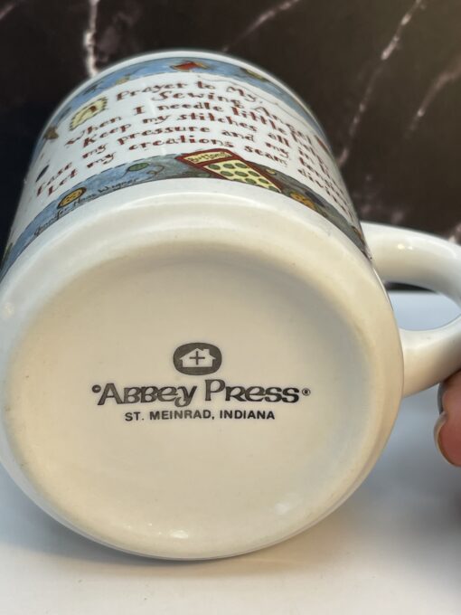 Meet your new favorite sip companion: the Sewing Angel Prayer Mug. It's the perfect #cupofmood for sewing queens, quilting mavens, and craft room angels. 